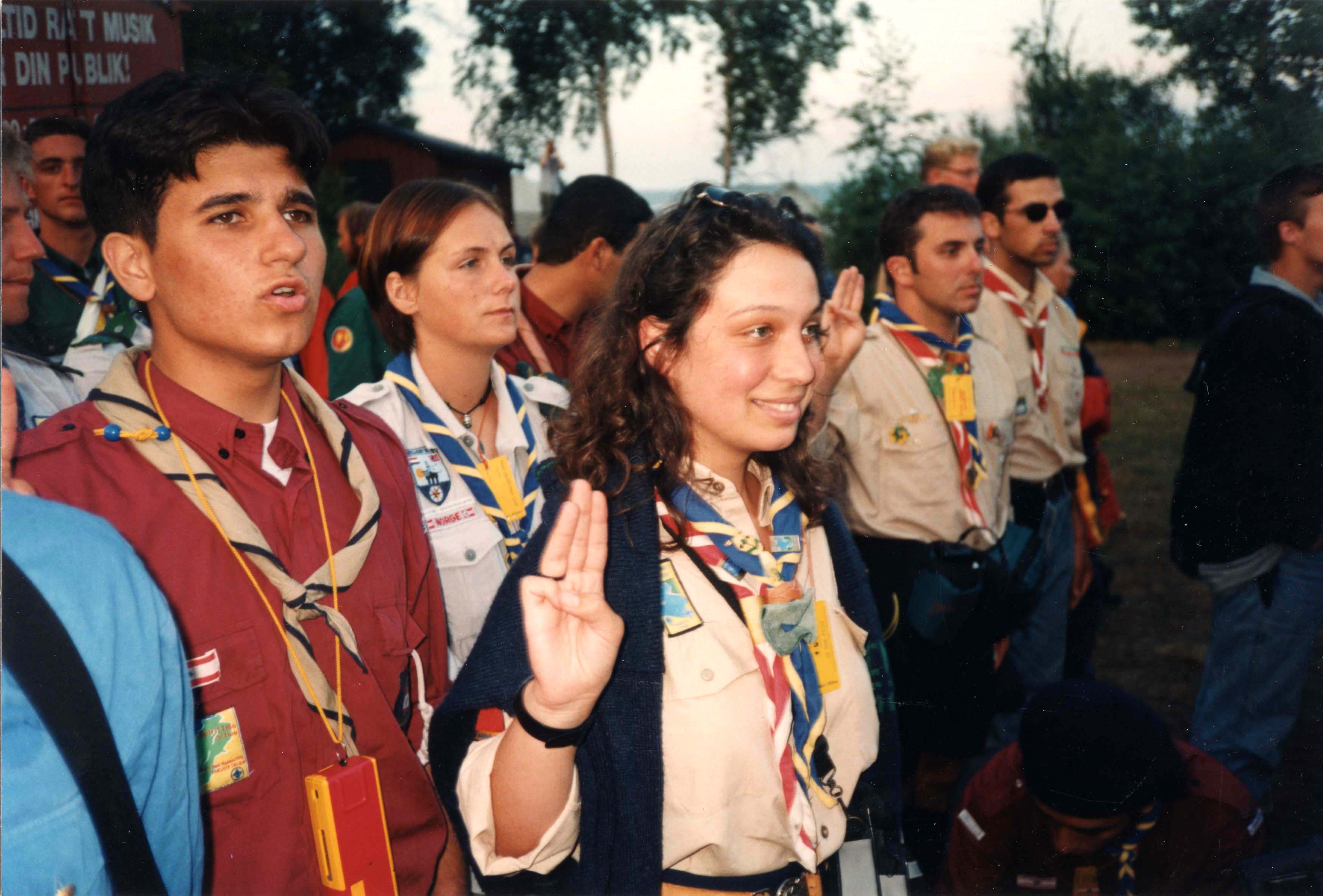 Scouts using the three-finger Scout sign